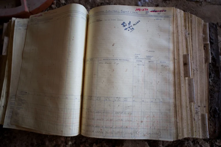 Old archive registers used to find birth records in Romanian archives